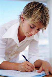 This contented student demonstrates the pleasures of filling out a job application.